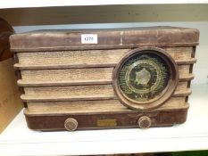 A Phillips Lamps Limited Bakelite radio, supplied by Heins & Co. Ltd., Broad Street, Hereford, a/f.