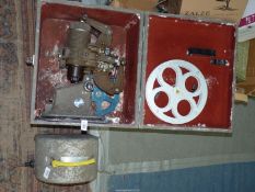 A Bell and Howell Gaumont Model 613 16mm Cine Projector in original fitted box and with heavy