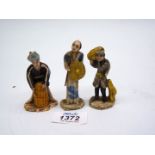 Three clay Oriental figures, 3" tall.