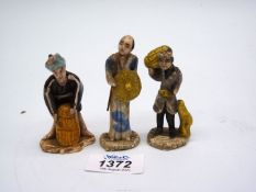 Three clay Oriental figures, 3" tall.