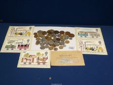 A quantity of foreign and English coins and stamps including George V and VI, Belgian stamps,