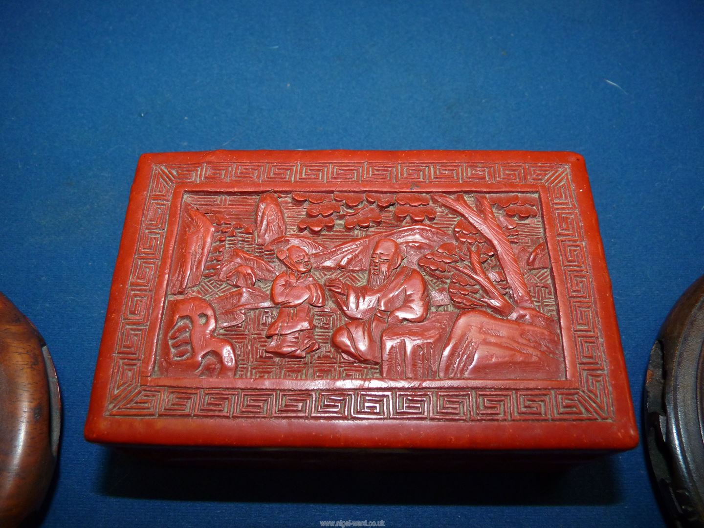 A Chinese red Cinnabar lacquer box 4" wide x 2 3/4" deep x 1 1/2" high and two hardwood stands. - Image 2 of 3