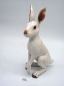 A well portrayed Studio Pottery hare by the potter John Hine, 13 1/2" tall,