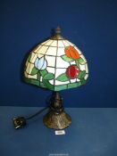 A modern Tiffany style lamp, blue, white, red and green colours, 17" tall.