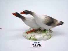 A continental porcelain model of a pair of Geese, 3 1/2" tall.