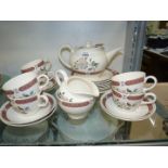 A Wedgwood 'Albany' tea service for six, with teapot, milk jug, sugar bowl and bread & butter plate.