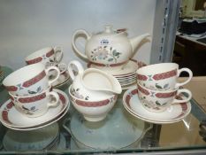 A Wedgwood 'Albany' tea service for six, with teapot, milk jug, sugar bowl and bread & butter plate.