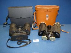 Two pairs of cased binoculars, Minox 8X 20 x 50 and Revue 10 x 50.