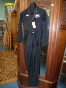 An Evening dress Suit by Brackley's, the jacket having tails, size small.