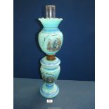 A blue glass oil lamp with scenes of a gent with a maid and a dog, large reservoir and shade,