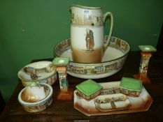 A Royal Doulton Dickens' ware bedroom set of wash jug (a/f) and bowl, a soap dish,