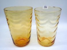 A pair of Whitefriars amber wavy optic ribbed glass vases, circa 1950, pattern no.