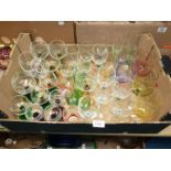 A quantity of coloured glass including champagne flutes,