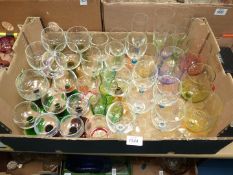 A quantity of coloured glass including champagne flutes,