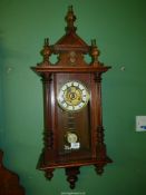 An Oak cased Vienna style wall Clock,