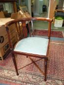 An Edwardian Mahogany framed corner Chair of Art Nouveau design,