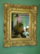 A gilt gesso framed Wall Mirror, 25 5/8' x 21 1/2'' overall.