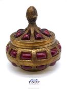 A vintage brass thick red caged bubble glass ornate trinket pot.