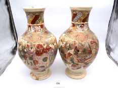 A pair of modern Satsuma style vases, 17 1/2'' tall, one been extensively repaired.