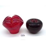 A very heavy red mottled glass sculpture with four bulging domes and cased n clear glass,