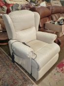 A beige upholstered reclining Chair.
