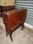 A Mahogany Sutherland Table standing on square legs and having nicely detailed cross-banding and