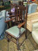 An Oak framed open armed Elbow Chair having turned front legs,
