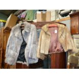 A Rabbit fur jacket, size small and a silver coloured fur coat, size 14.