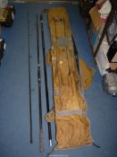 A Catch Carp rod carrying bag, TF Gear Throwing Stick 6' and two fishing rod parts.