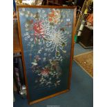 A framed Embroidery in pink, white, orange and green colourway with floral/bird design,