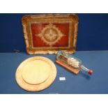 A quantity of miscellanea to include a vintage round wooden bread board,