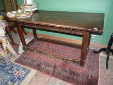 An early and unusual refectory table the Oak base having peg-joyned stop - chamfered legs united by