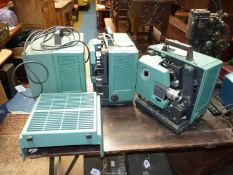 A set of three Bell and Howell TQIII 1695 16mm Autoload Filmsound Cine Projectors one missing the