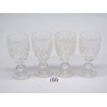 Four Waterford Crystal liqueur glasses.