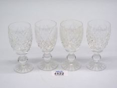 Four Waterford Crystal liqueur glasses.