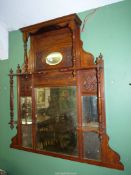 A probably Edwardian Mahogany framed Overmantel Mirror with turned supports,