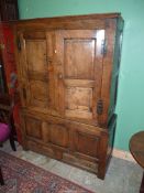 A fine old peg-joyned circa 1800 Oak Cupboard on Chest having raised and fielded panels,