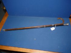 A silver knopped Walking Cane, London and a silver collared walking stick (some dents and splits).