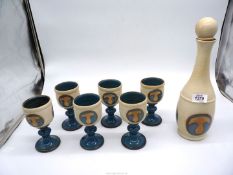 A set of six Laugharne Pottery goblets with decanter and stopper.