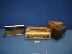 Two transistor radios - Sharp and Ferguson and an old Kodak camera in canvas case.