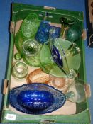 A quantity of coloured glass including dishes, vases and glasses in Bristol blue,