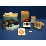 A Polaroid 1000 Land camera with unopened pack of ten instant photo cards together with a vintage