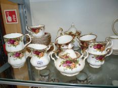 A Royal Albert 'Old Country Roses' part tea set to include teapot, seven cups and eight saucers,
