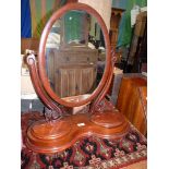 A Mahogany shaving mirror, 21" wide x 25" tall.