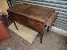 A circa 1900 Mahogany Pembroke Table standing on turned legs and having a frieze drawer to one end,