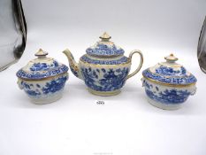 An ensemble of teapot and two sugar boxes,