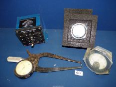 A Precision Caliper Gauge, a multi way mains to 12 volt transformer and two unused Ammeters.