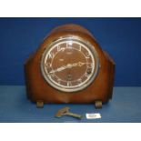 An Enfield Mantle clock with Westminster chimes, with key, 10'' x 8 3/4''.