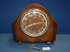 An Enfield Mantle clock with Westminster chimes, with key, 10'' x 8 3/4''.