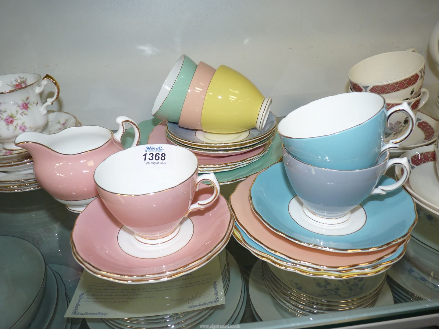 A part Colclough, Harlequin bone china tea set including six cups and saucers, six tea plates,